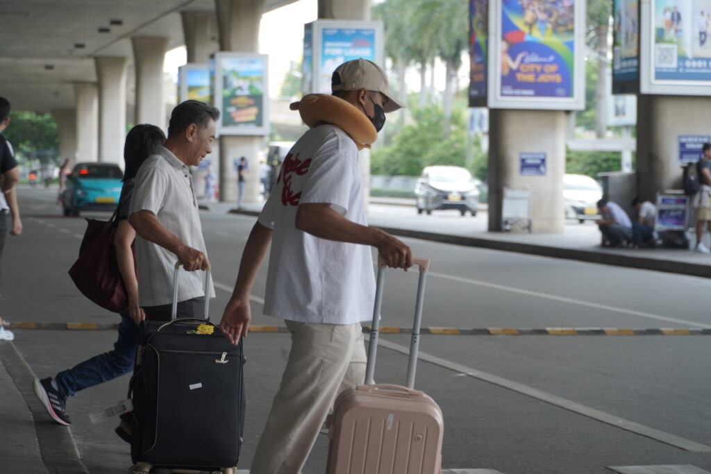 Airport fast track in Vietnam - passengers at Tan Son Nhat international arrivals