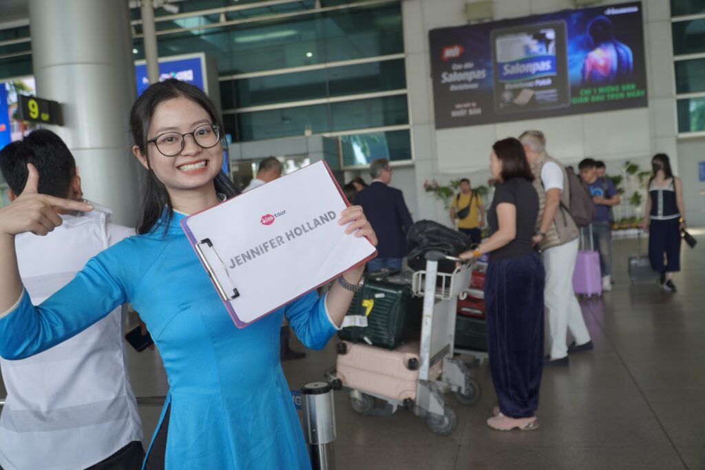 Flying to Vietnam - KissTour fast track staff assisting a traveler at the terminal