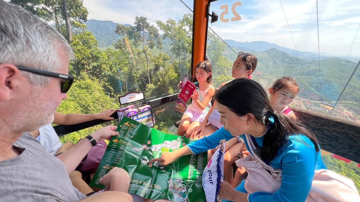 KissTour guide with guests in the Ba Na Hills cable car