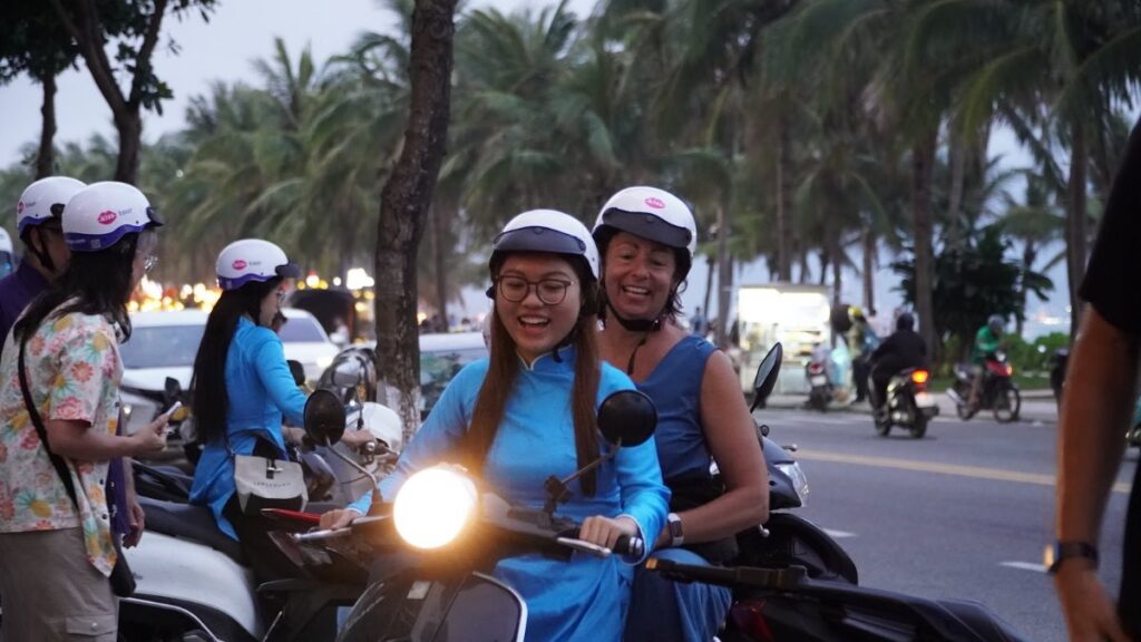 KissTour women riders with guests on the road in Da Nang, the crew families ride with when visiting Da Nang with kids