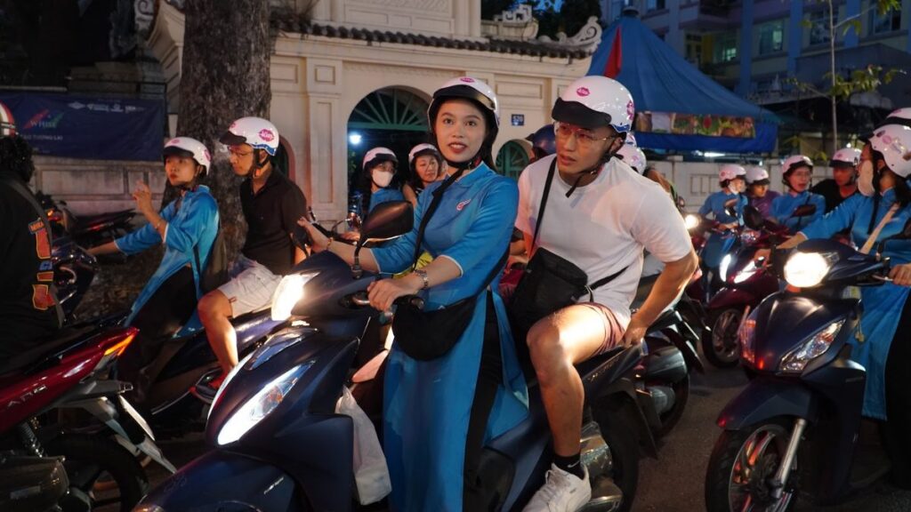 Getting around Ho Chi Minh City at night with KissTour women riders and guests on motorbikes