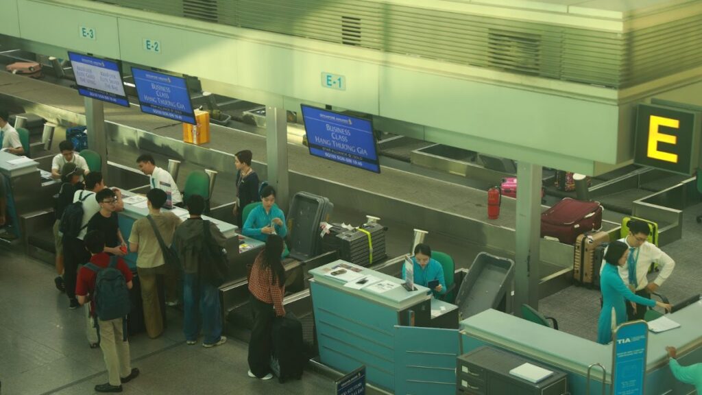 Passengers queuing at immigration counters in a Vietnamese international airport
