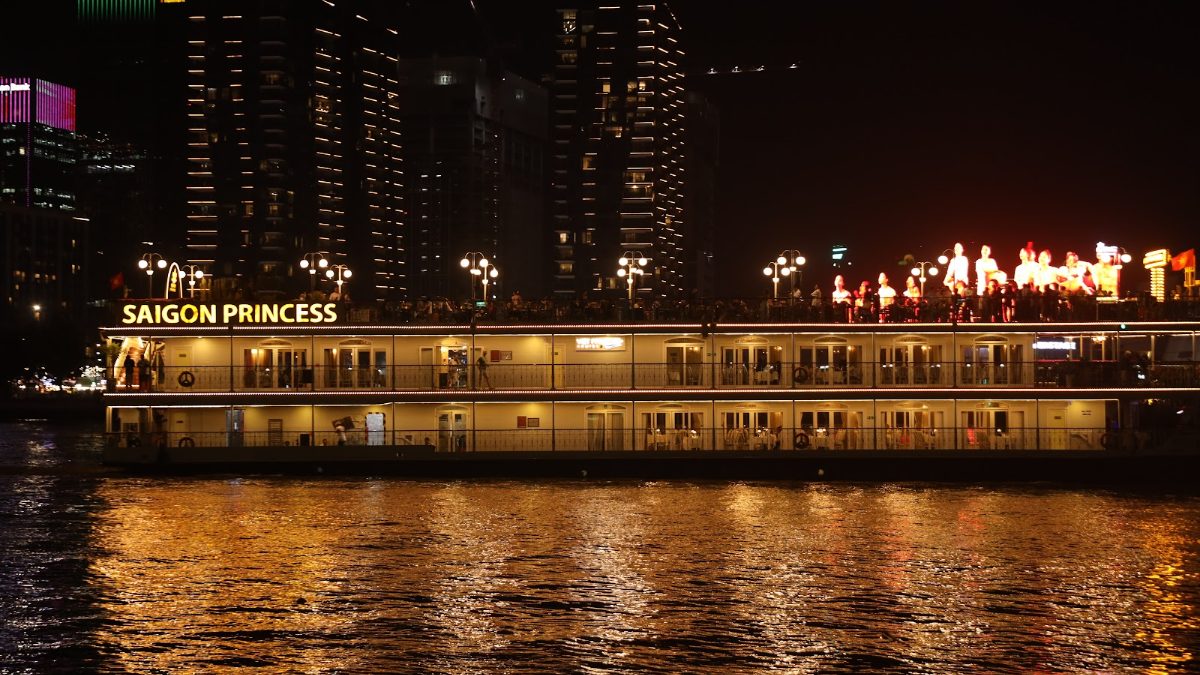 Live show on the top deck of a Saigon dinner cruise boat on the Saigon River at night