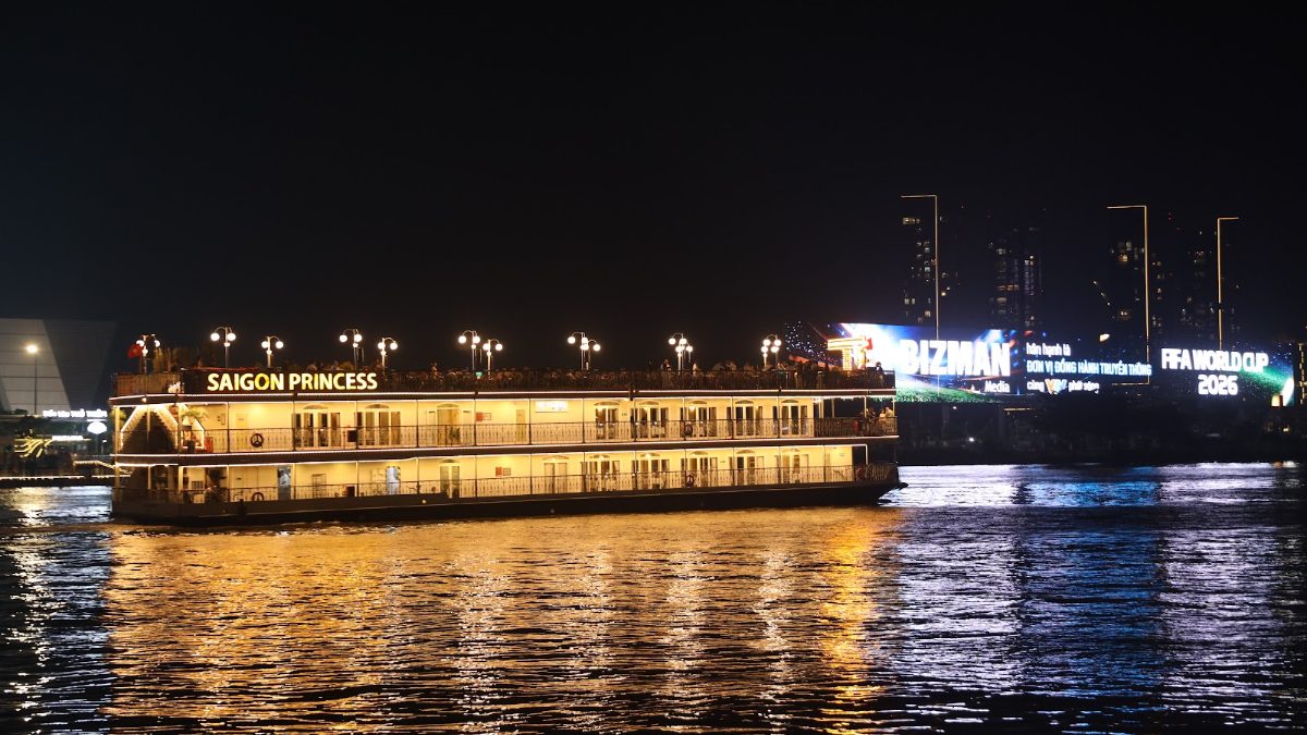 Saigon Princess dinner cruise boat lit up on the Saigon River at night