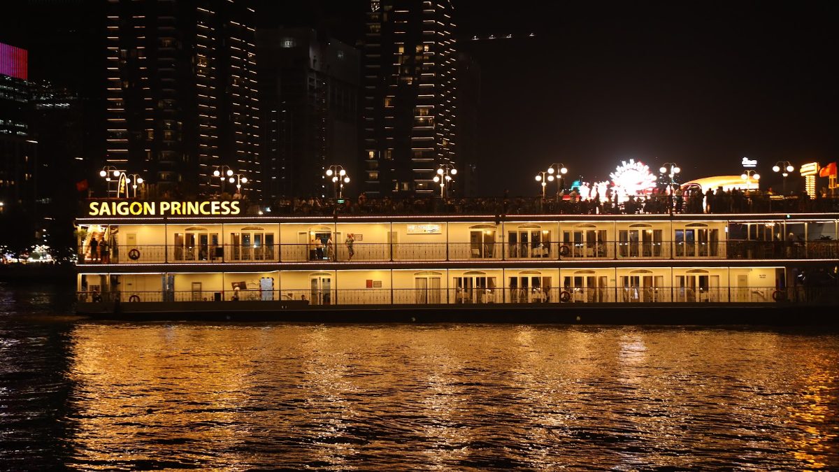 Saigon River and city lights after sunset seen from Bach Dang Wharf