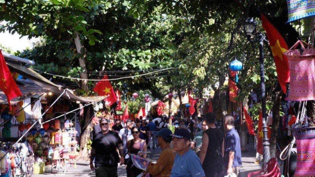 Hoi An old town street with lanterns and flags