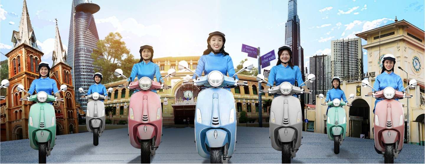 KissTour áo dài lady drivers on colourful scooters in front of Saigon landmarks