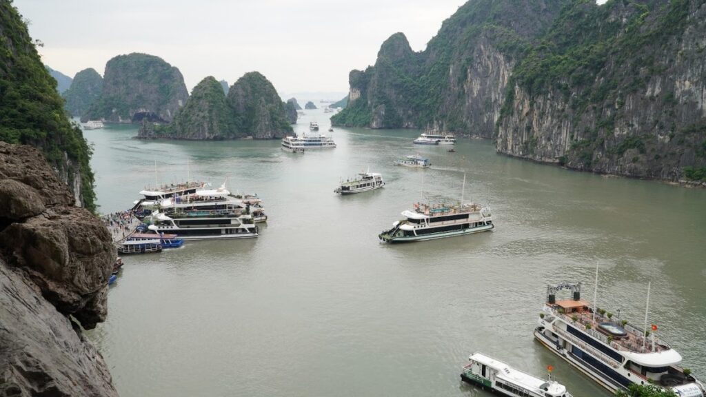 Cruise boats anchored among the karsts of Ha Long Bay