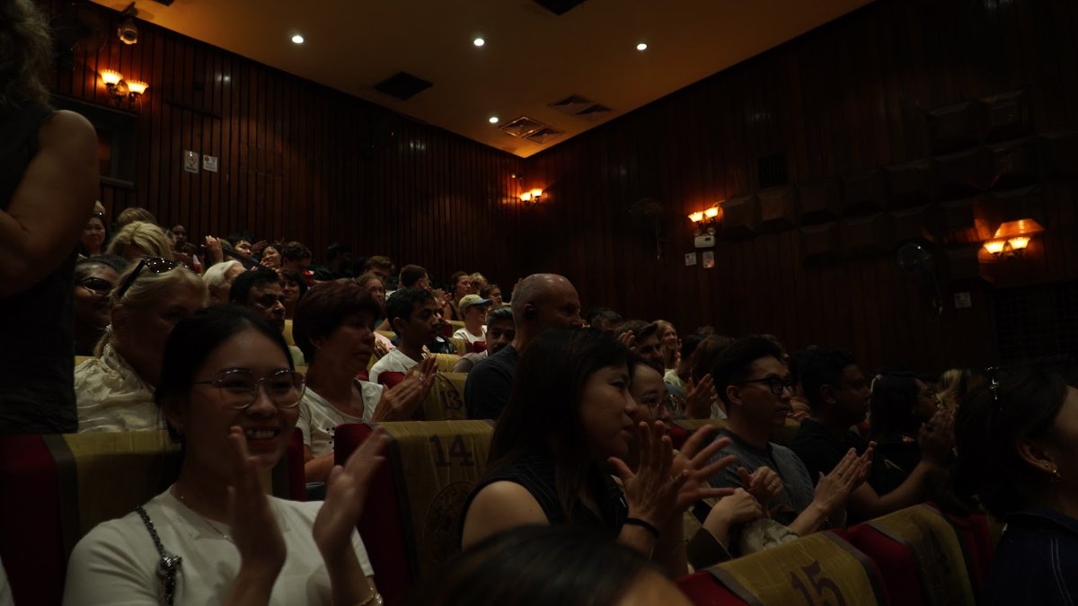 Audience watching a water puppet show in Hanoi