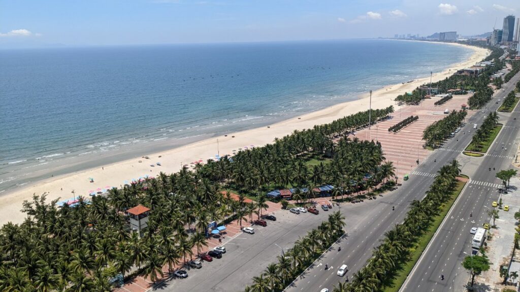 My Khe Beach in Da Nang with the city skyline behind the sand