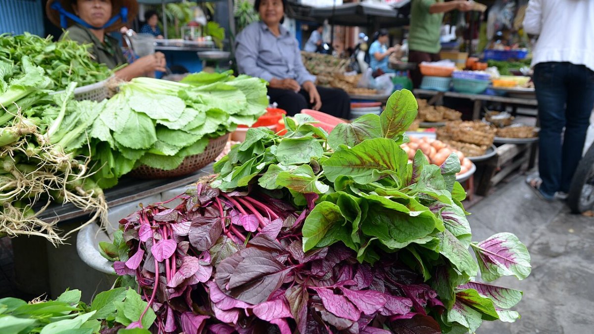 Fresh vegetables for sale at a Vietnamese market, where food is inexpensive